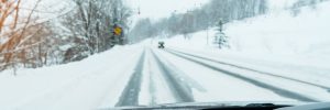 View of a snowy road from a car