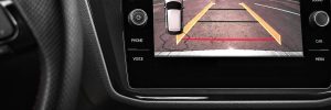 Car display and rear view camera. Parking assistant inside car. Video parking system in modern car.